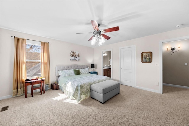 carpeted bedroom featuring connected bathroom and ceiling fan