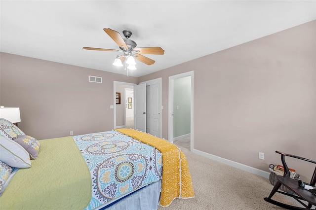 carpeted bedroom with a closet and ceiling fan