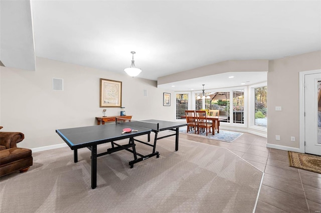 game room featuring a notable chandelier and tile patterned flooring