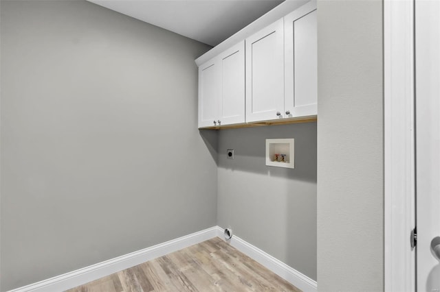 laundry room with cabinets, washer hookup, light hardwood / wood-style floors, and electric dryer hookup