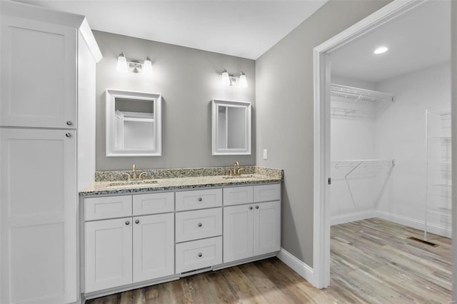 bathroom featuring hardwood / wood-style floors and vanity