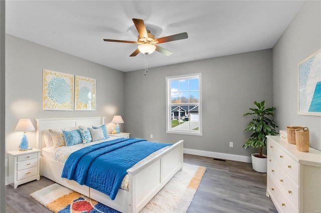 bedroom with light wood-type flooring and ceiling fan