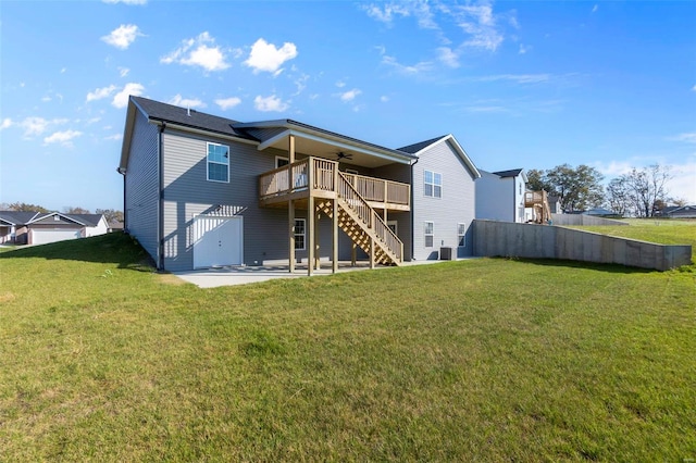 back of house with a lawn, central air condition unit, ceiling fan, a patio area, and a deck