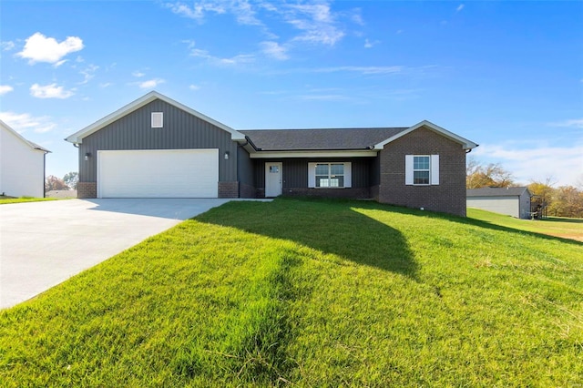 view of front of property featuring a garage and a front yard