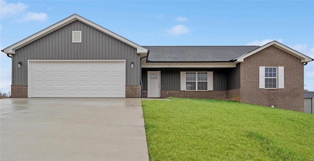 ranch-style home with a garage and a front yard