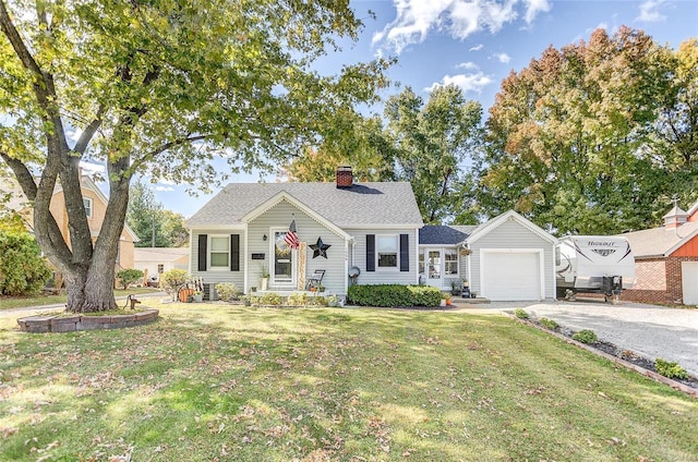 view of front facade with a garage and a front yard