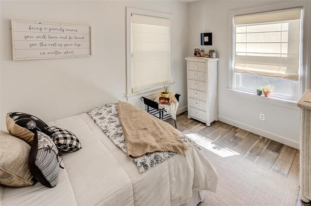 bedroom with light hardwood / wood-style flooring