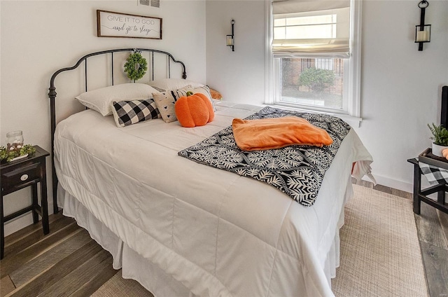 bedroom featuring wood-type flooring