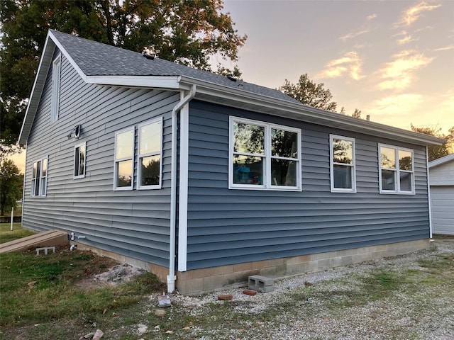 view of property exterior at dusk