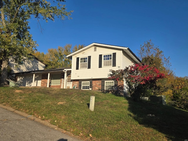 tri-level home with a front yard