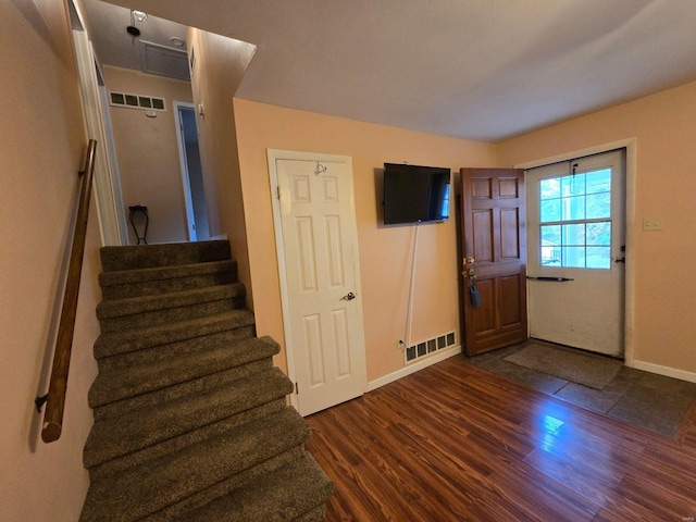 foyer entrance with dark wood-type flooring