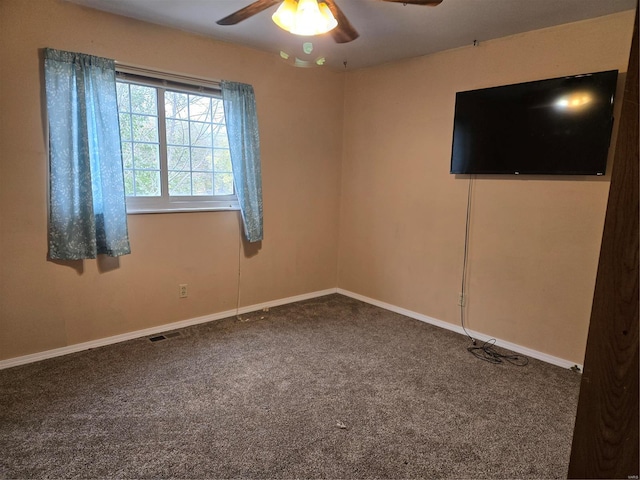 carpeted empty room with ceiling fan