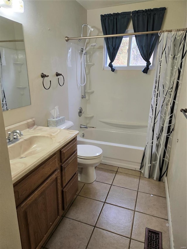 full bathroom featuring toilet, tile patterned flooring, vanity, and shower / tub combo with curtain