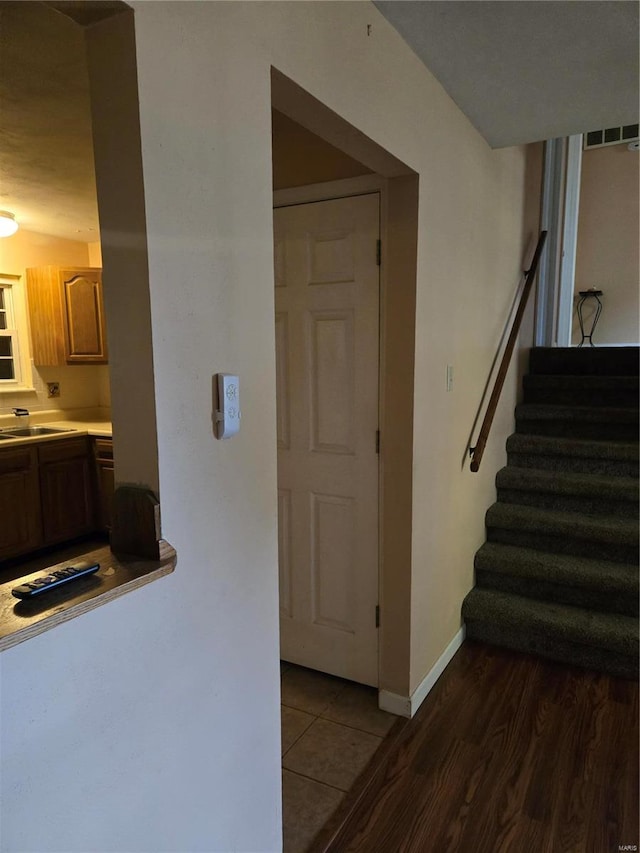 interior space with hardwood / wood-style floors and sink