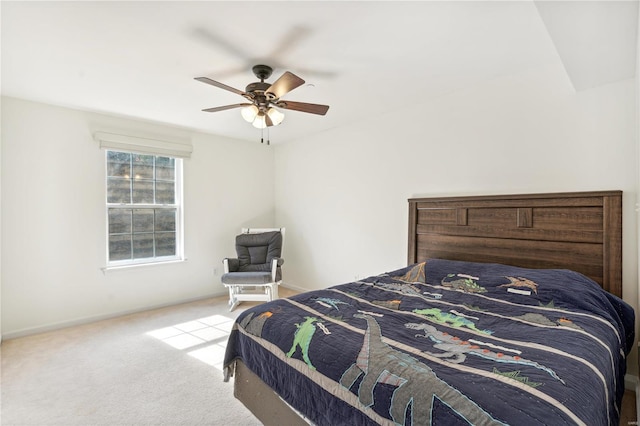 bedroom with ceiling fan and light carpet