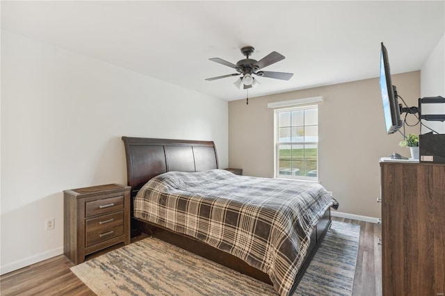 bedroom with hardwood / wood-style flooring and ceiling fan