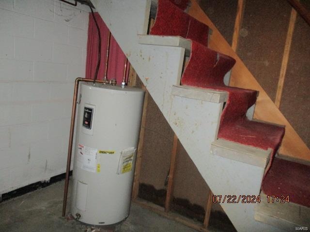 utility room featuring electric water heater