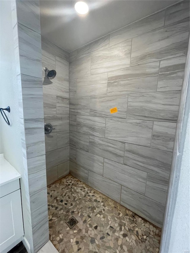 bathroom with tiled shower