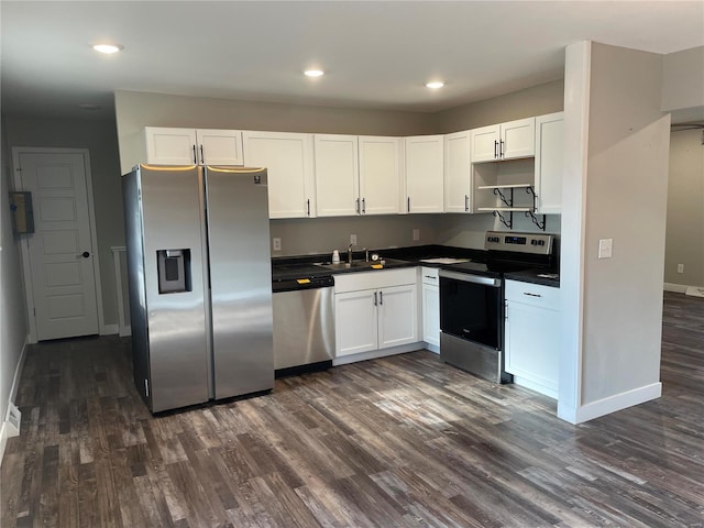 kitchen with white cabinets, sink, dark wood-type flooring, and appliances with stainless steel finishes