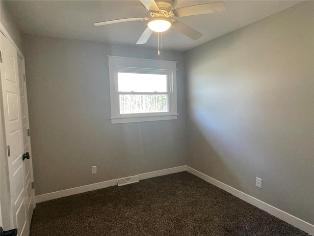 carpeted spare room with ceiling fan