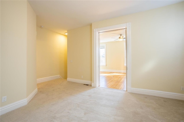 unfurnished room with light carpet