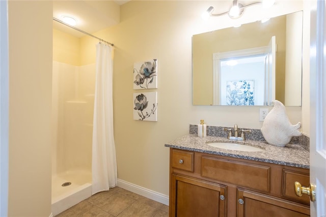 bathroom featuring vanity, tile patterned floors, and a shower with shower curtain