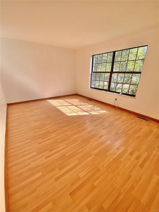 empty room with light wood-type flooring