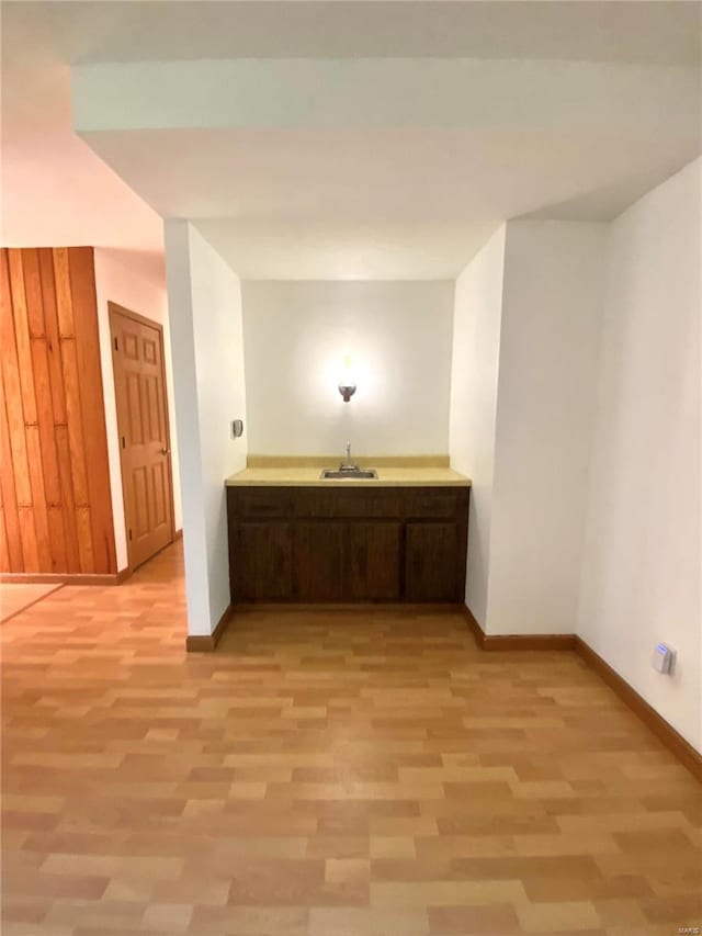 interior space featuring sink and wood-type flooring