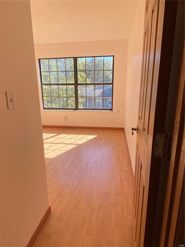 spare room featuring light wood-type flooring