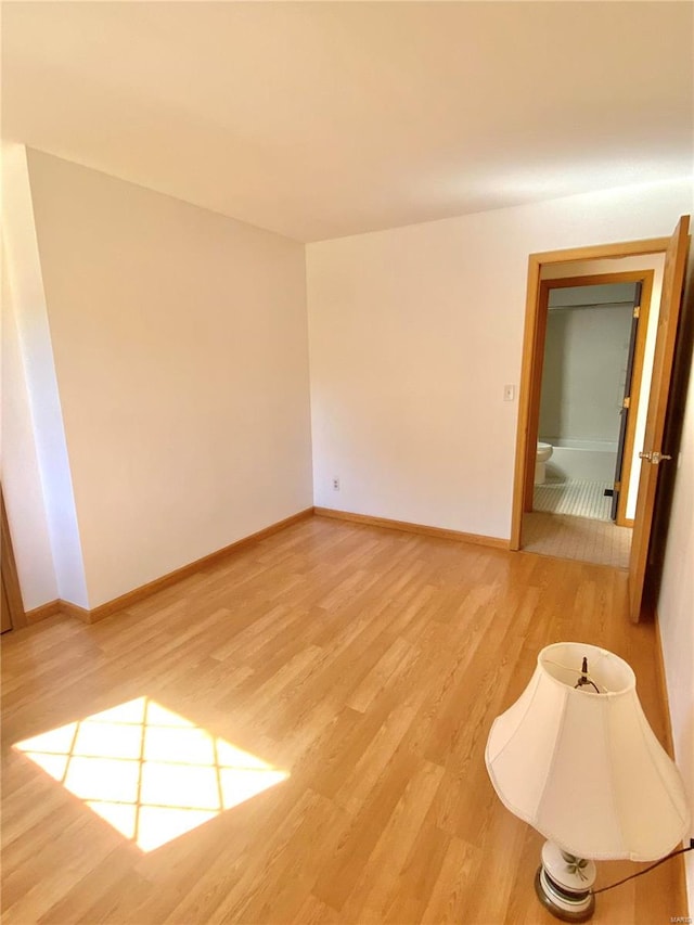 unfurnished room with light hardwood / wood-style flooring