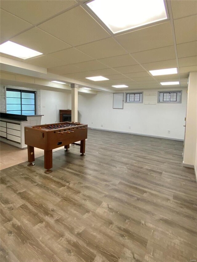 rec room featuring a paneled ceiling and wood-type flooring