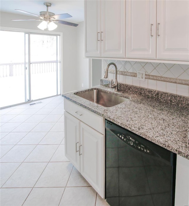 kitchen with white cabinetry, sink, and black dishwasher