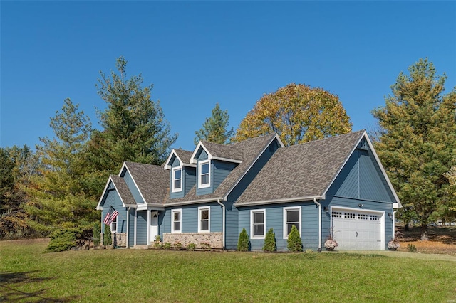 view of front facade featuring a front yard and a garage