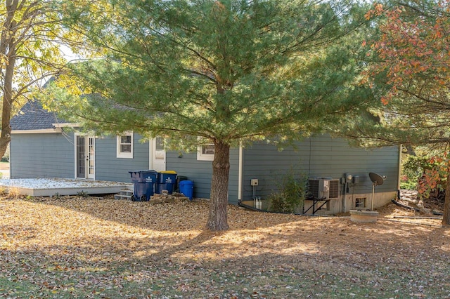 view of side of home featuring central AC unit