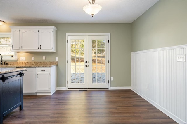 kitchen featuring white cabinetry, french doors, and plenty of natural light