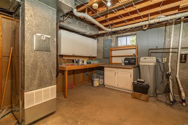 basement with heating unit and electric panel