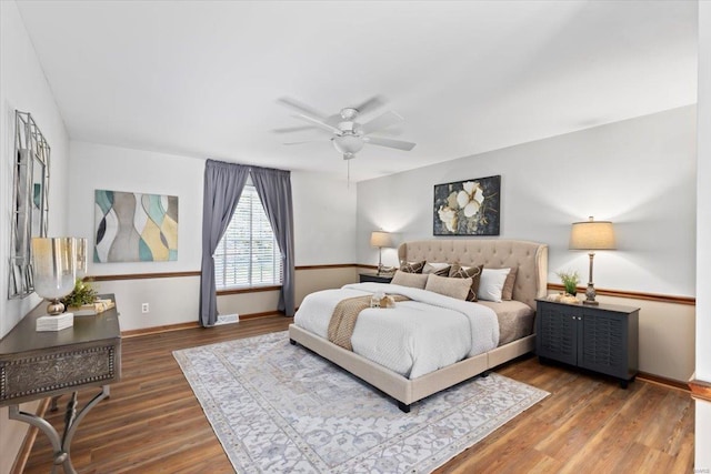 bedroom featuring dark hardwood / wood-style floors and ceiling fan