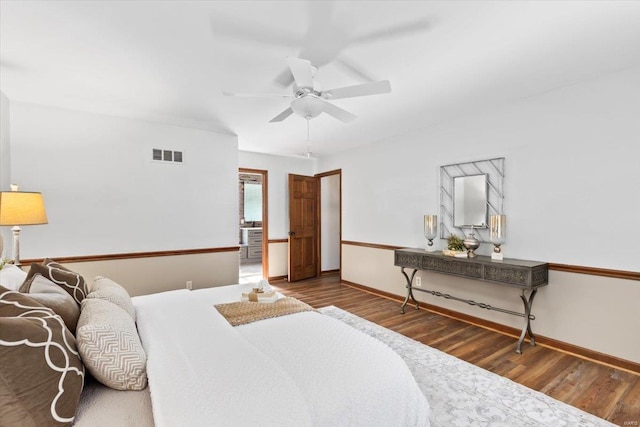 bedroom featuring dark wood-type flooring and ceiling fan