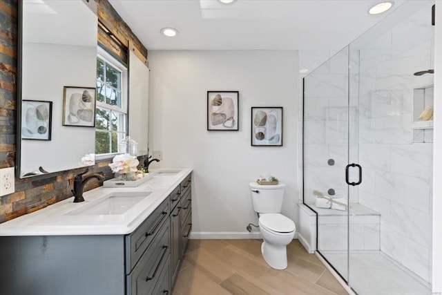 bathroom with wood-type flooring, toilet, walk in shower, vanity, and decorative backsplash