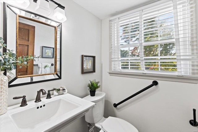 bathroom with sink and toilet