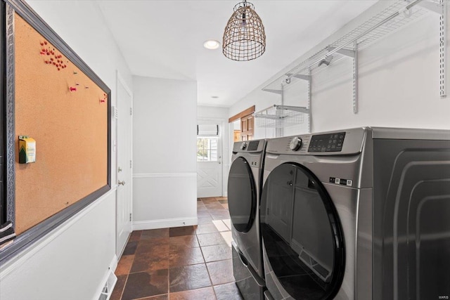 clothes washing area with independent washer and dryer