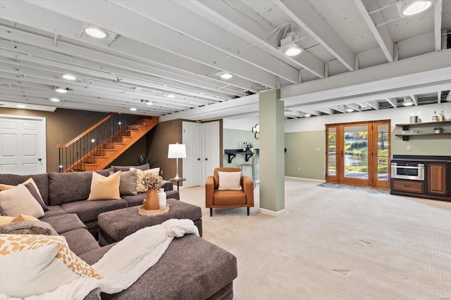 living room featuring beamed ceiling and carpet floors