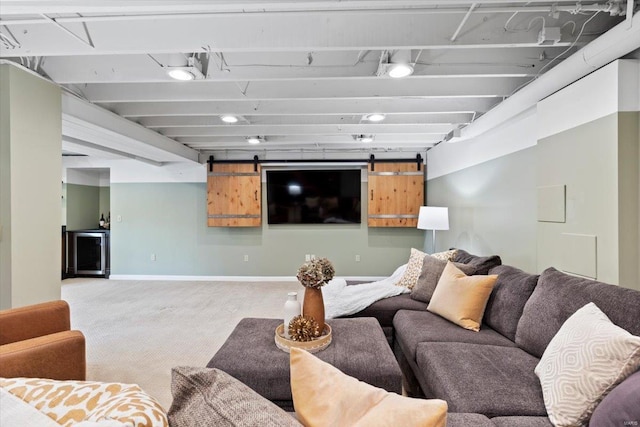 living room featuring carpet and a barn door