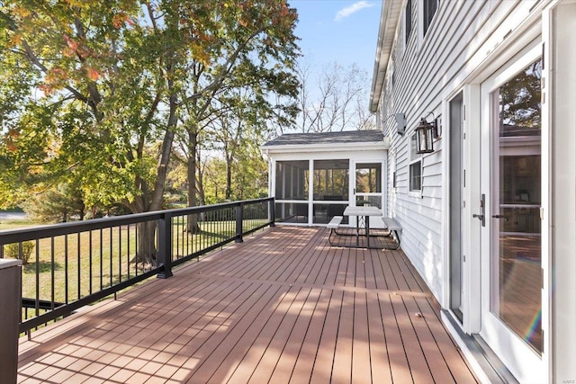 wooden terrace featuring a sunroom