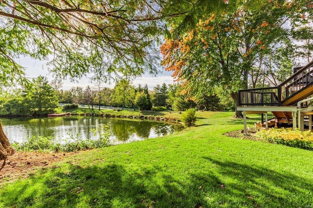 view of yard featuring a deck with water view