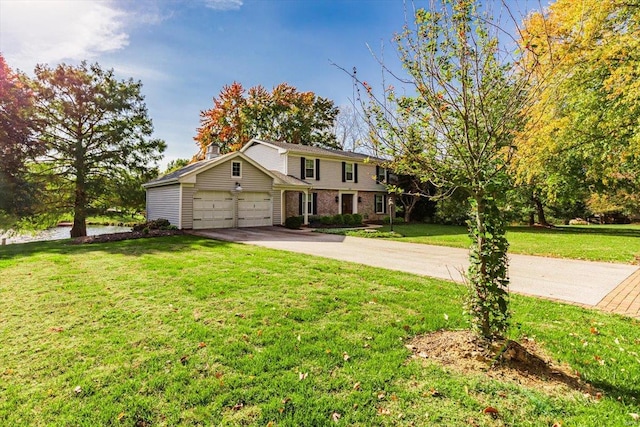 view of front of home with a front lawn and a garage