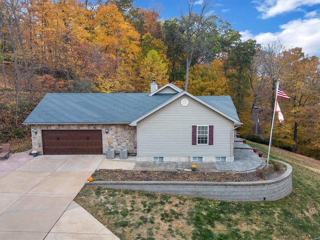 view of front of home with a front yard and a garage