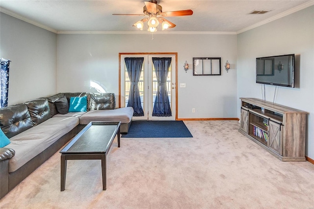 living room with light carpet, ornamental molding, and ceiling fan