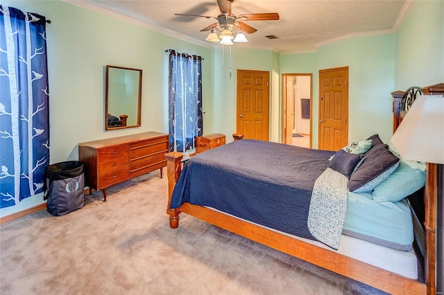 bedroom with ornamental molding, carpet floors, and ceiling fan