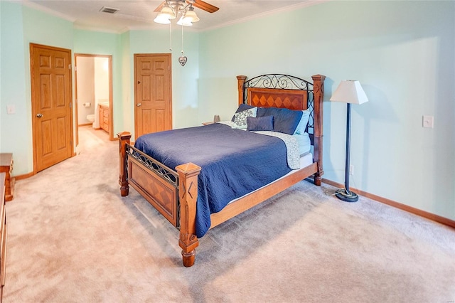 bedroom featuring ornamental molding, connected bathroom, carpet, and ceiling fan